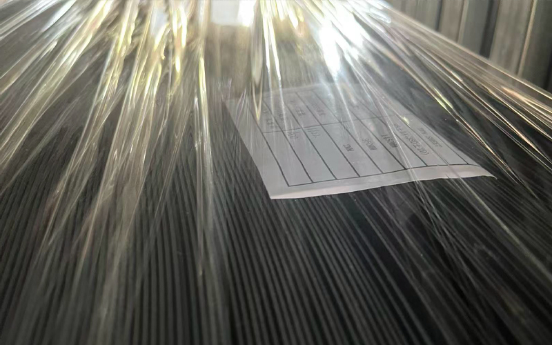 Stacked thermoplastic sheet with identification label