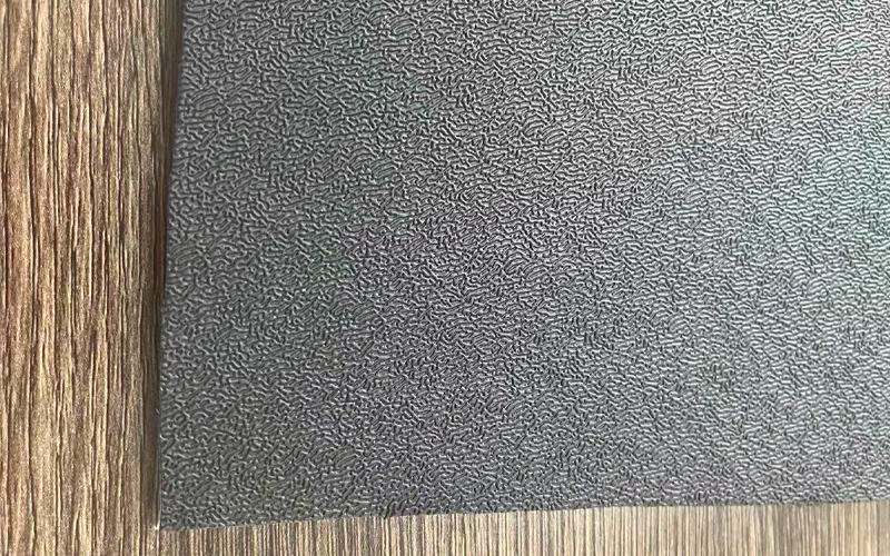 Embossed grain surface on thermoplastic elastomer sheet